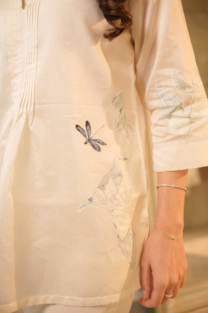 Ivory Top with Blue Appliqué